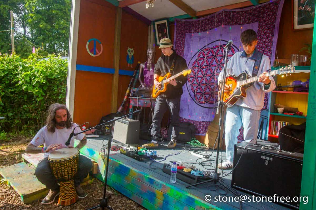 Friends smiling together at ReKINDle Festival.