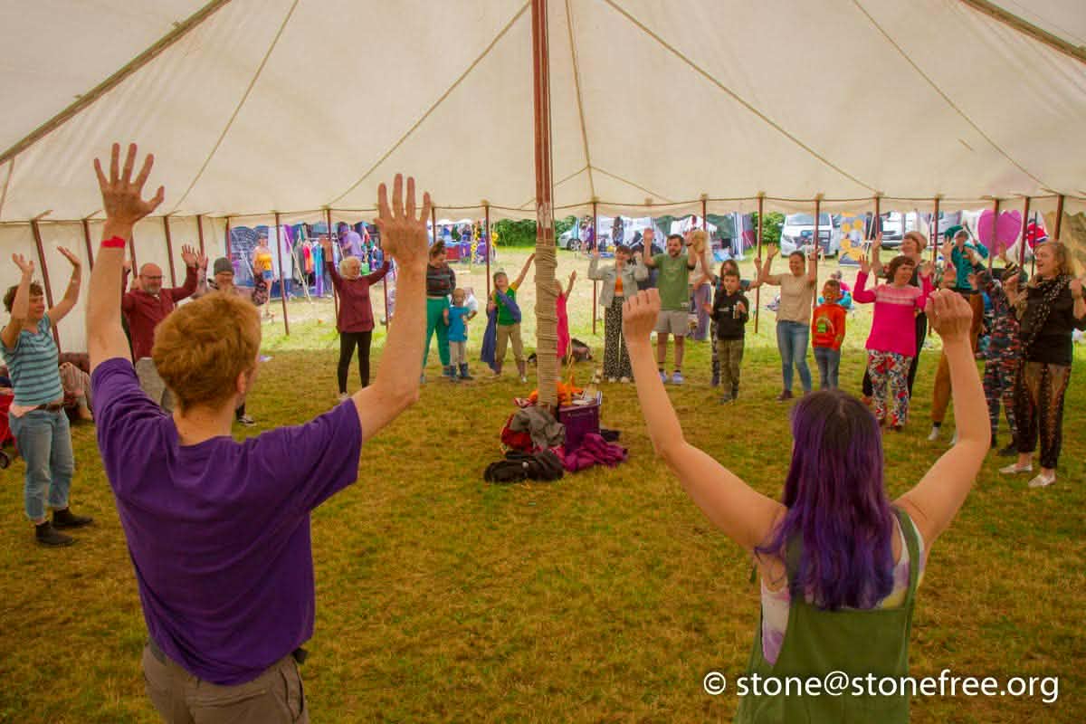 People joining a creative festival workshop.